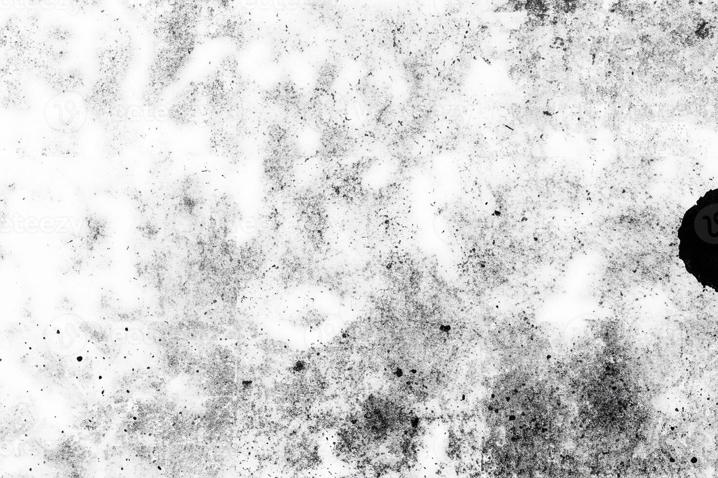 Abstract grunge white texture with black speckled and distressed elements, ideal for creative backgrounds or overlays. photo