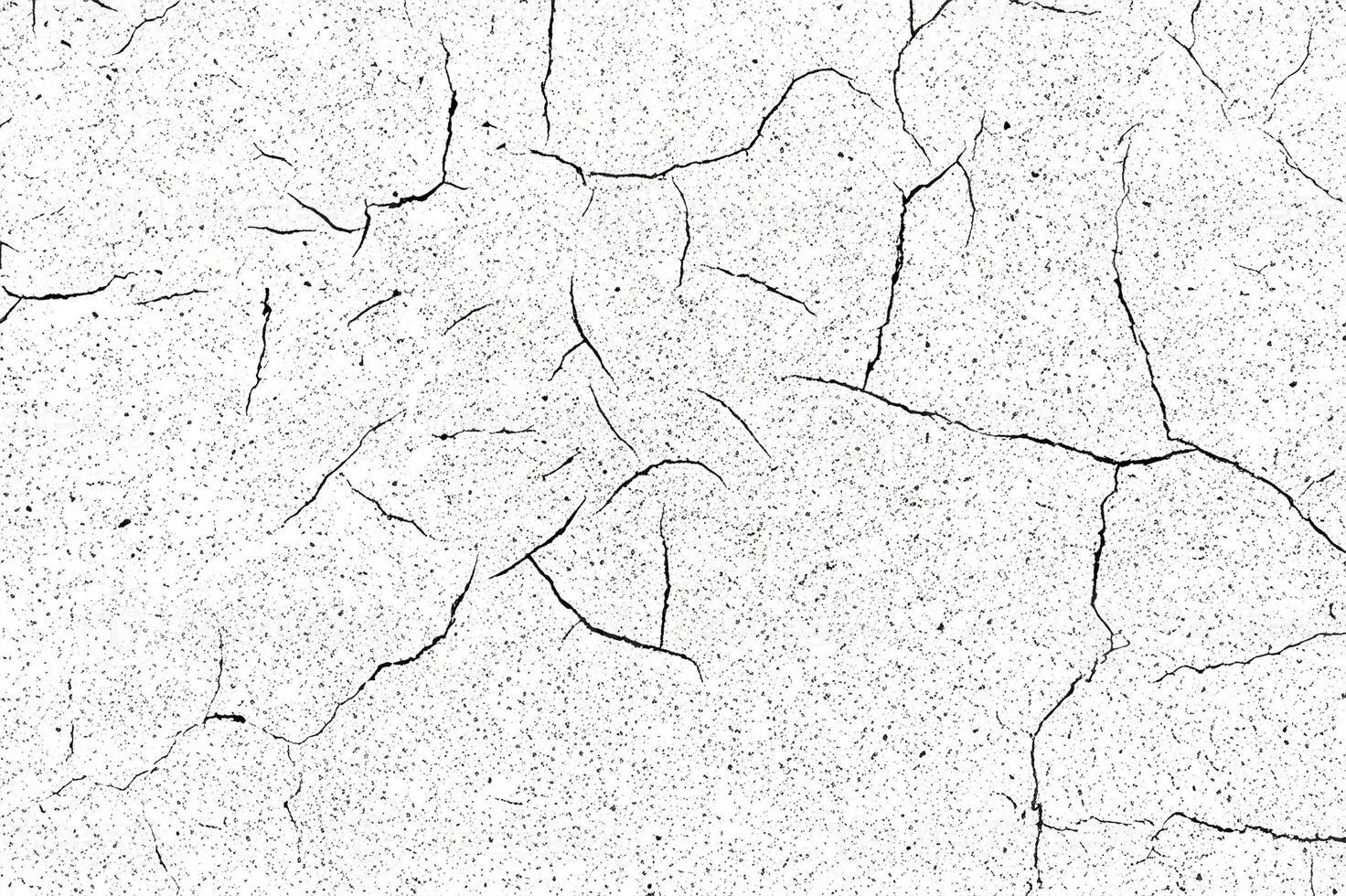 Close-up of a cracked white surface with fine black speck details, perfect for backgrounds or creative design projects. photo