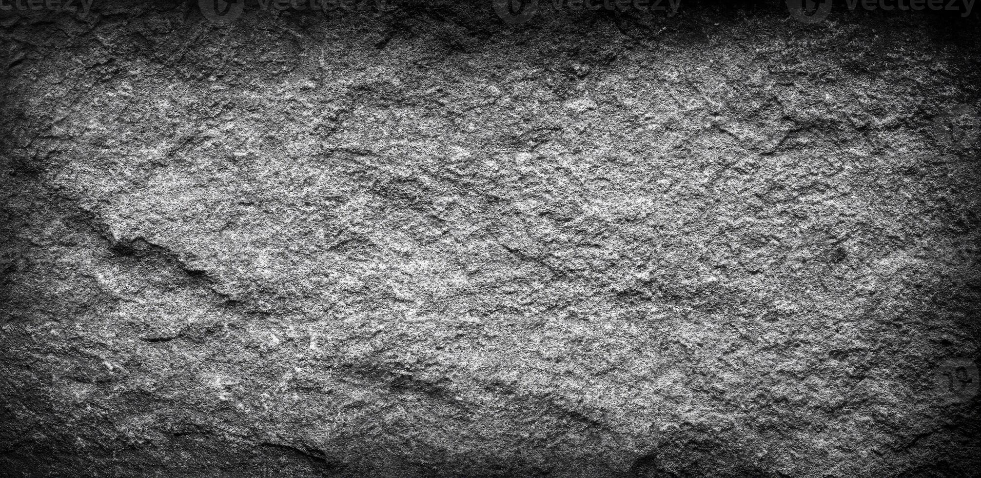 Grainy stone surface with a rugged texture, perfect for backgrounds, overlays, or industrial design projects. photo