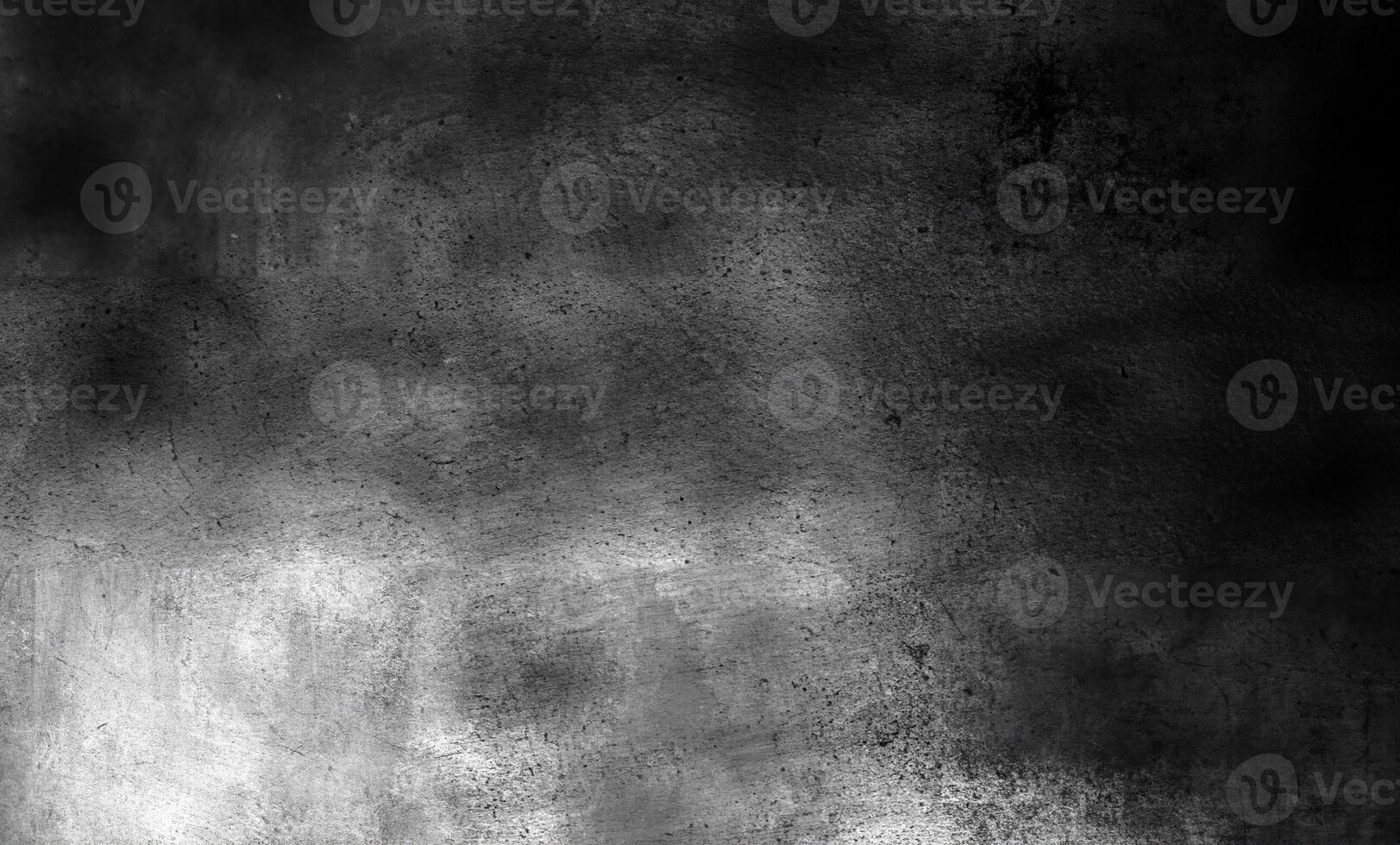 Abstract grunge black textured background with scratches, light reflections, and uneven surface patterns. photo