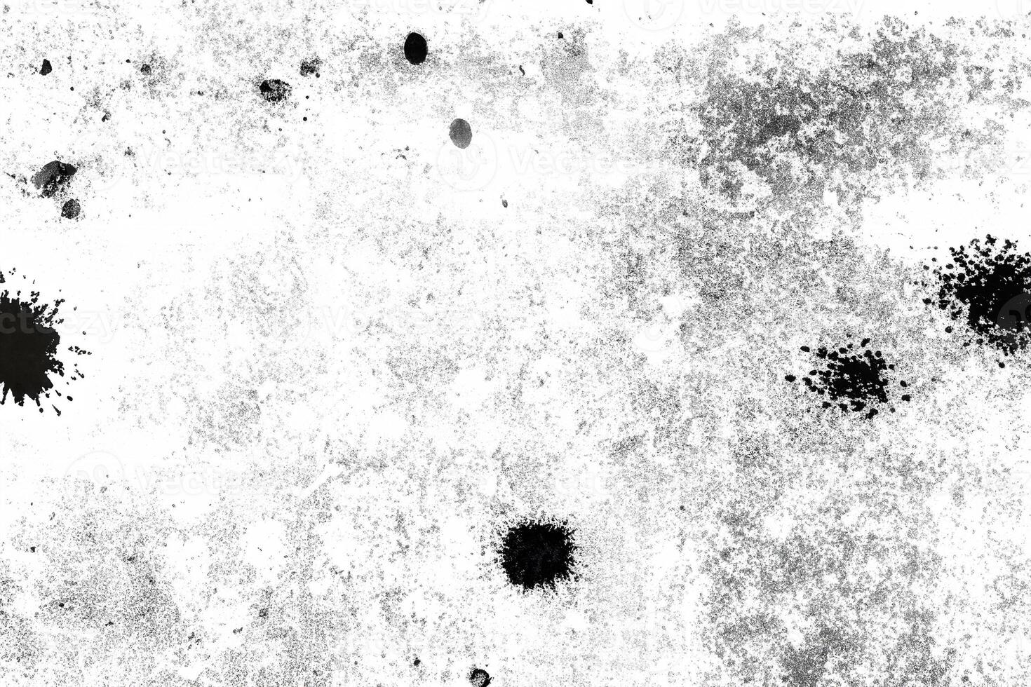 Abstract distressed texture with black speckles and rough patches on a white background, ideal for overlays or backgrounds. photo