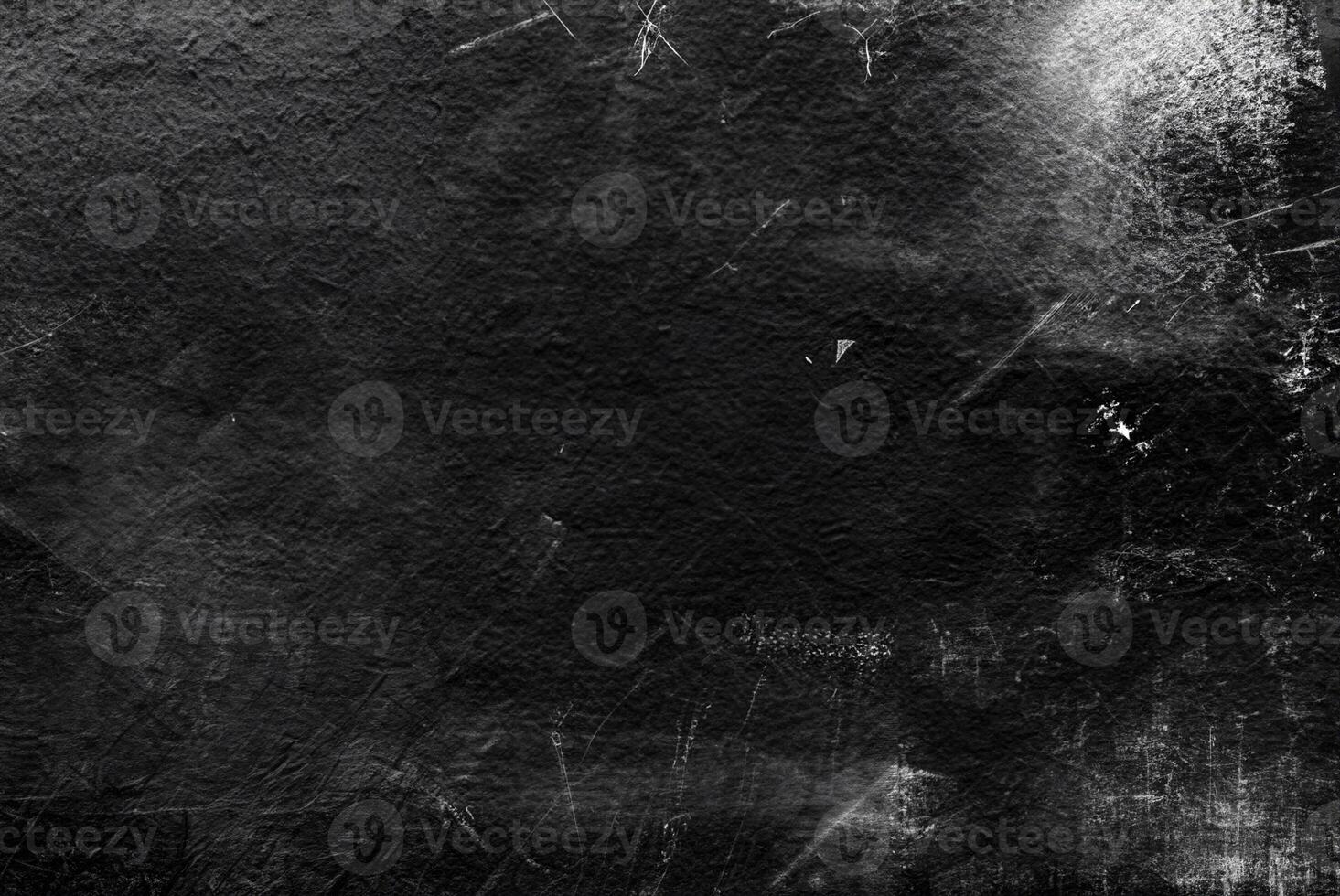 Dark grunge black texture with scratches and distressed elements, ideal for abstract backgrounds or overlays. photo