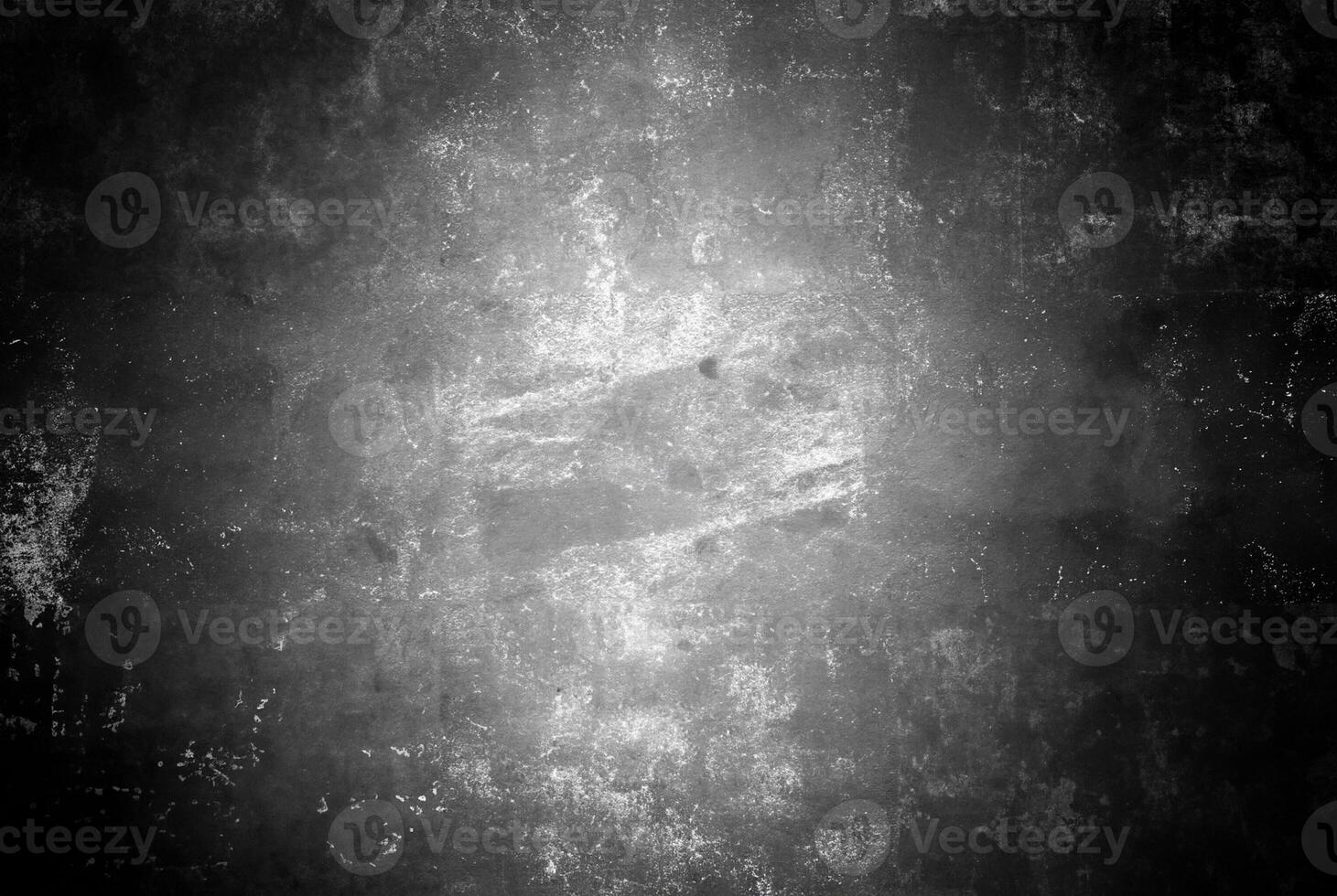Abstract black and white grunge texture with a distressed, scratched surface, ideal for backgrounds and overlays. photo