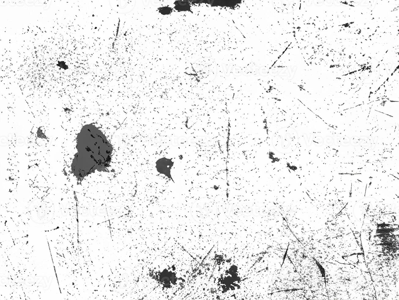 Abstract grunge texture featuring scattered black scratches on a white surface, perfect for overlays and backgrounds. photo
