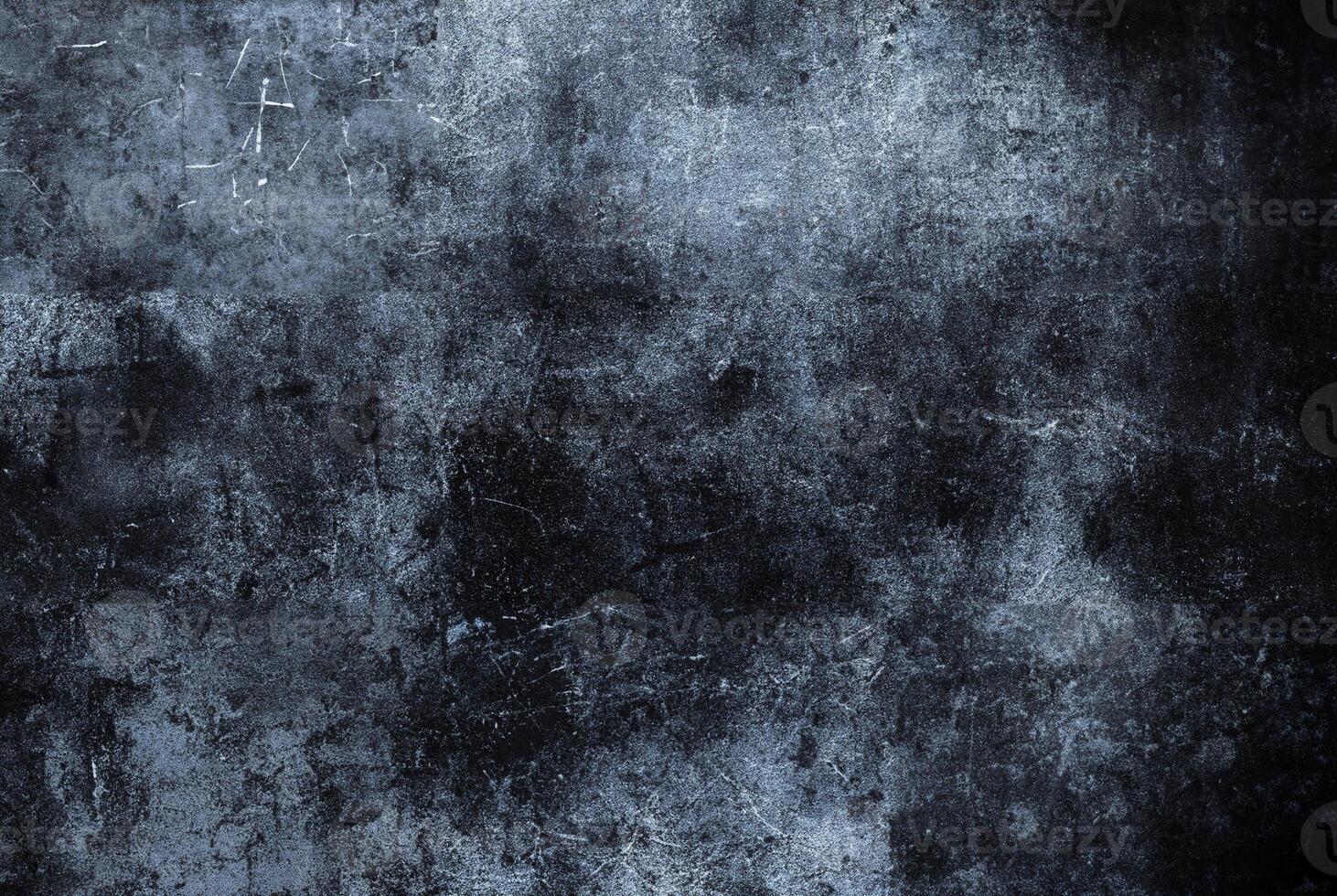Distressed dark blue grunge texture with worn scratches, creating a dramatic and rugged background ideal for artistic and design projects. photo