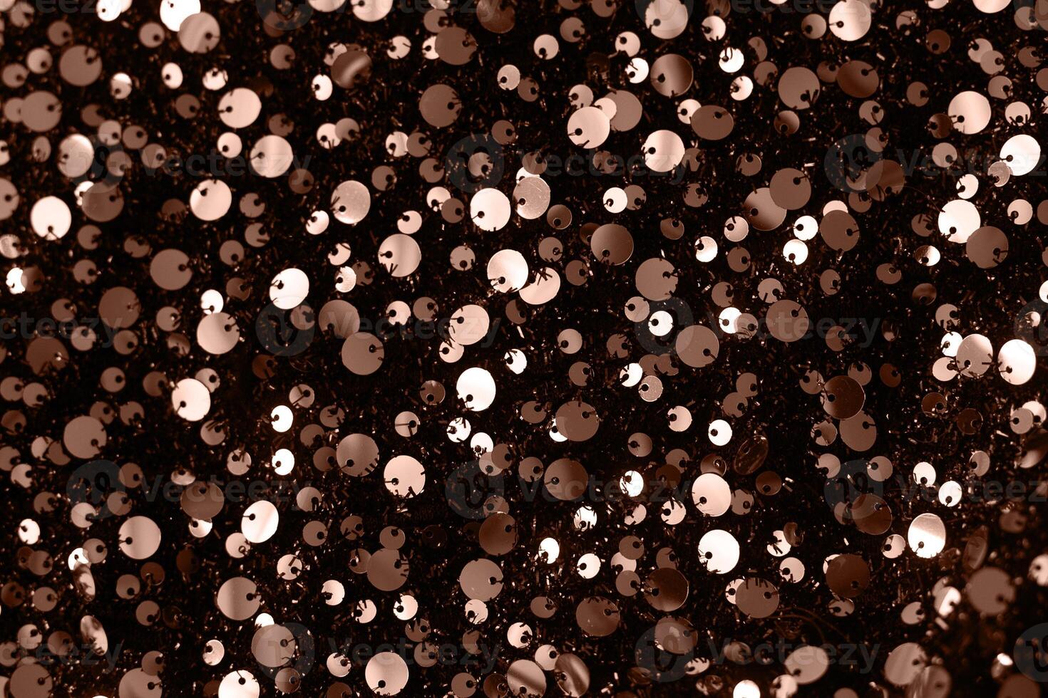 Abstract texture background with sequins. Color of the Year 2025 Mocha Mousse color. Chocolate or Brown Background photo