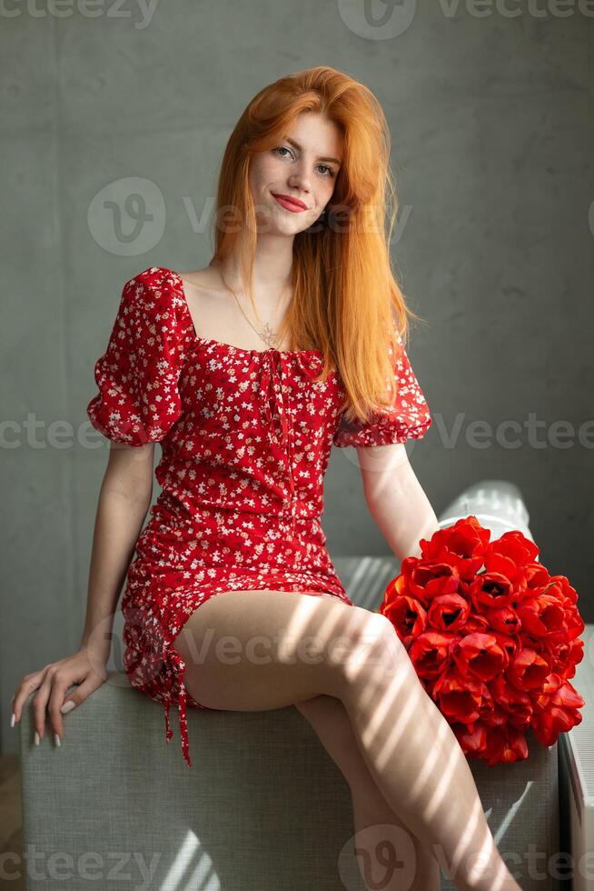 Young happy woman with a bouquet of lulips. photo