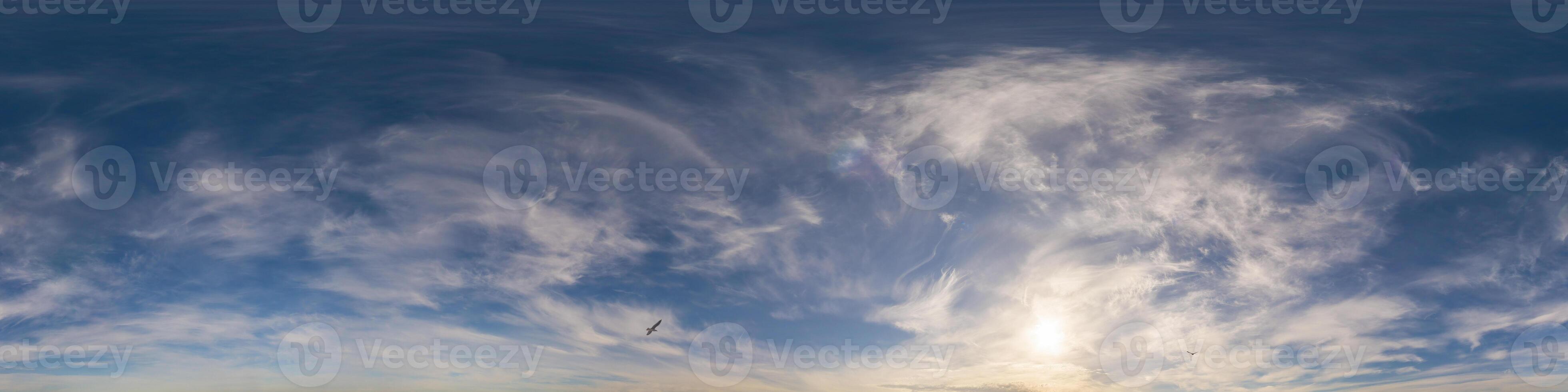 Dark blue sunset sky panorama with Cumulus clouds. Seamless hdr pano in spherical equirectangular format. Complete zenith for 3D visualization, game and sky replacement for aerial drone 360 panoramas. photo