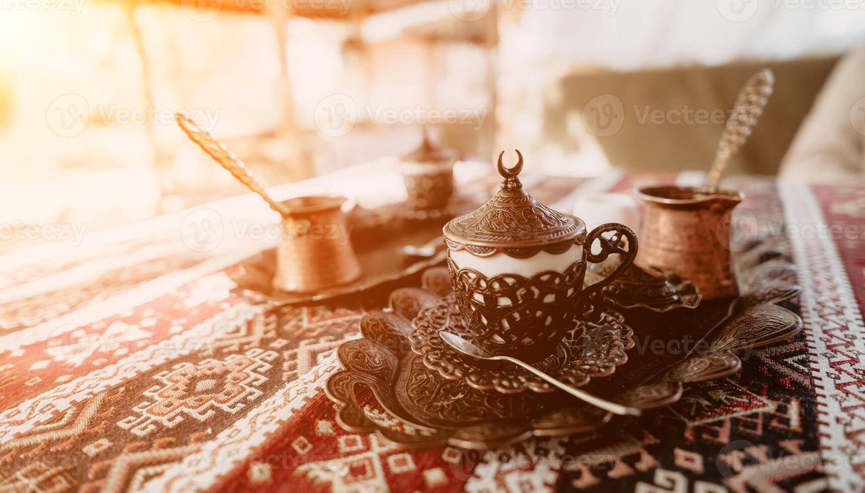 Traditional Turkish Coffee Set on an Ornate Tablecloth photo