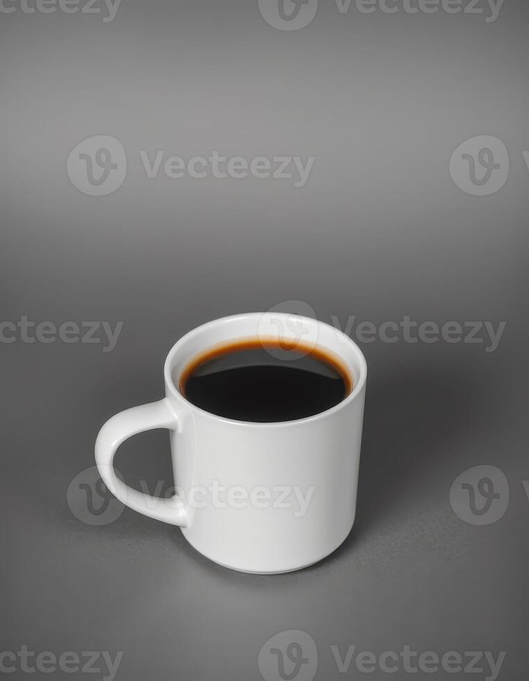 Warm cup of black coffee resting on a smooth gray surface in a calm setting photo