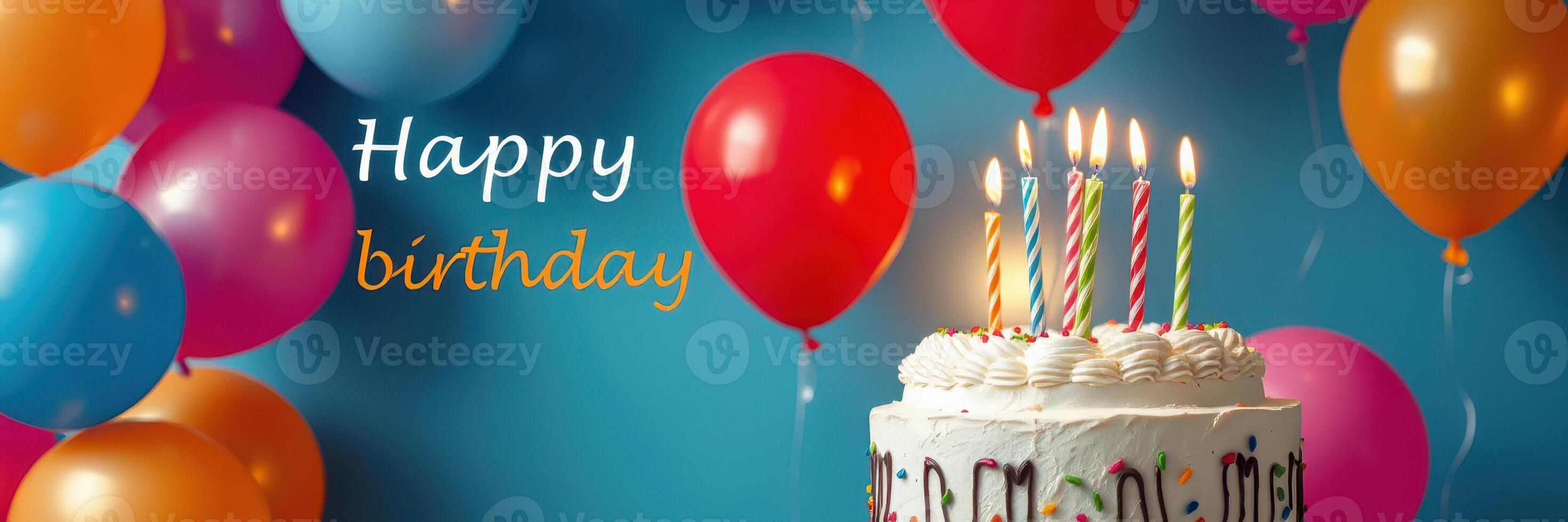 Colorful birthday celebration with cake, balloons, and candles creating a cheerful atmosphere photo