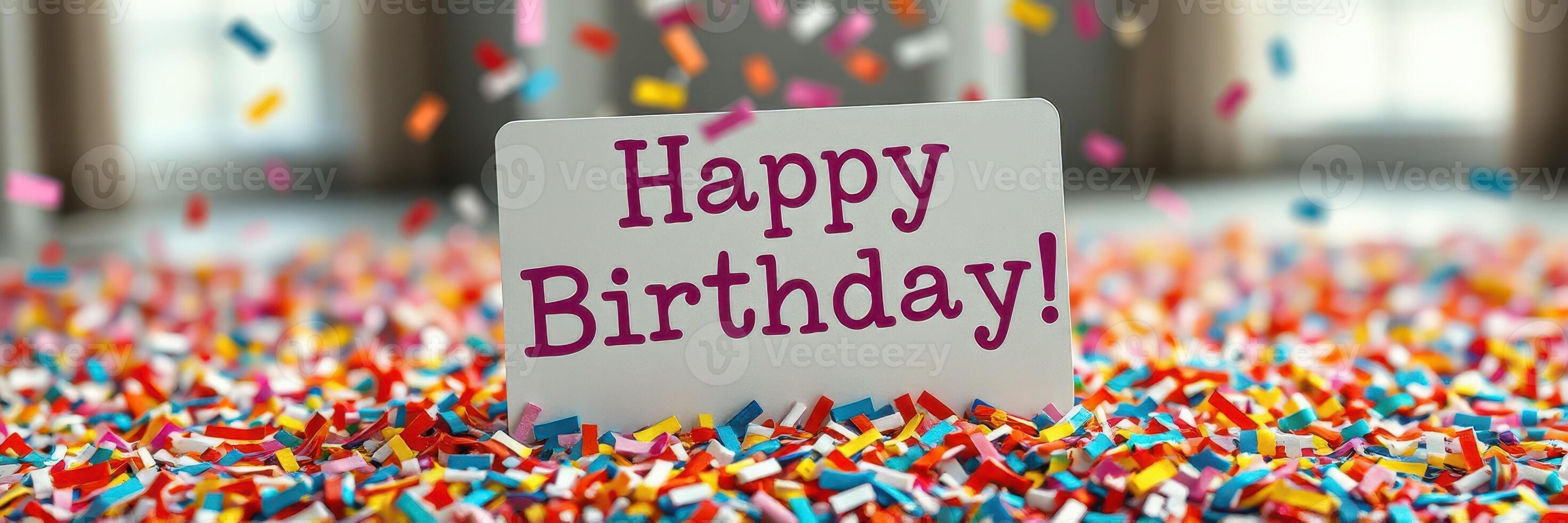 Colorful confetti surrounds a joyful birthday message during a festive celebration at a cheerful event photo