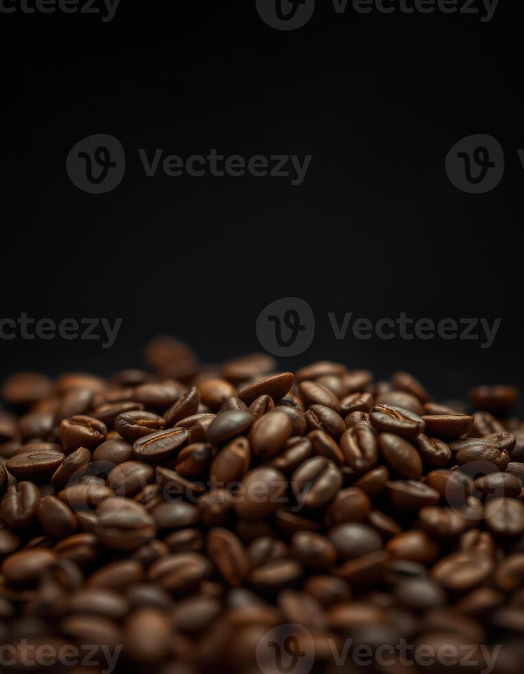 Freshly roasted coffee beans piled against a dark background highlighting their rich color and texture photo