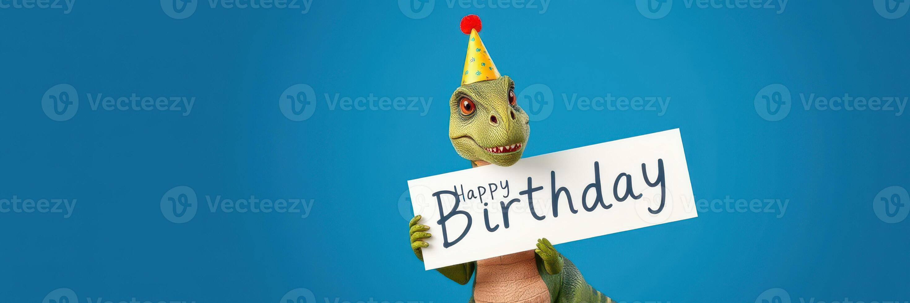 Colorful dinosaur with a birthday hat celebrating and holding a happy birthday sign indoors during a festive event photo