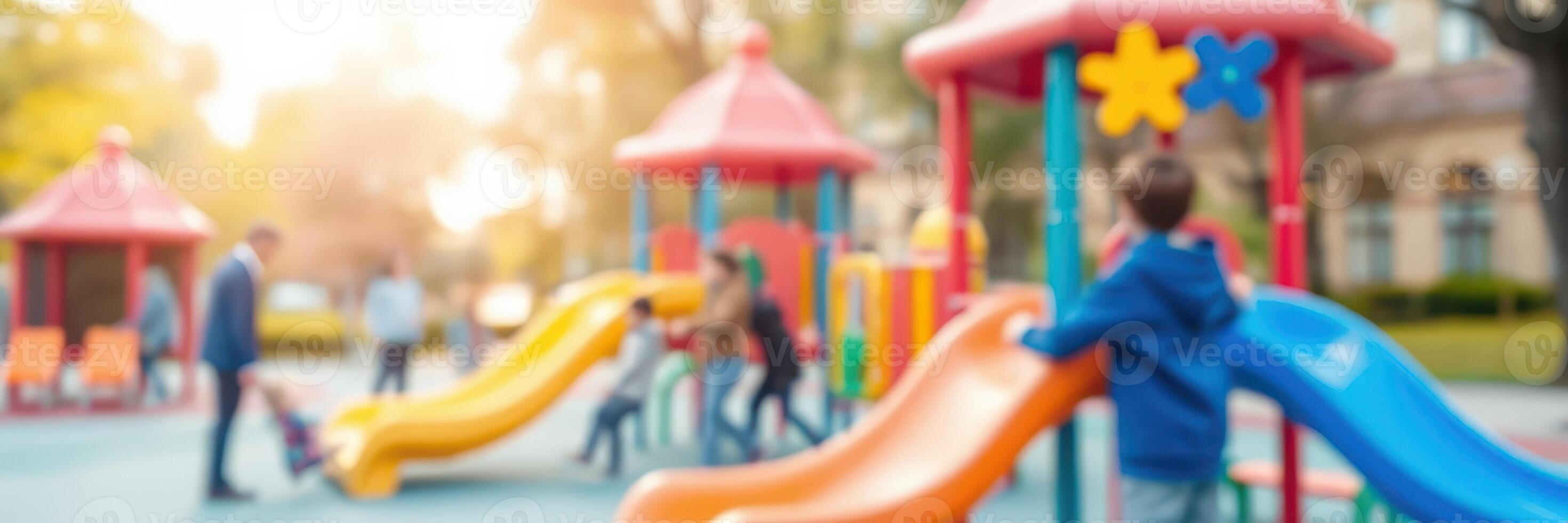 Children playing joyfully at a colorful playground during a sunny afternoon in a suburban park photo