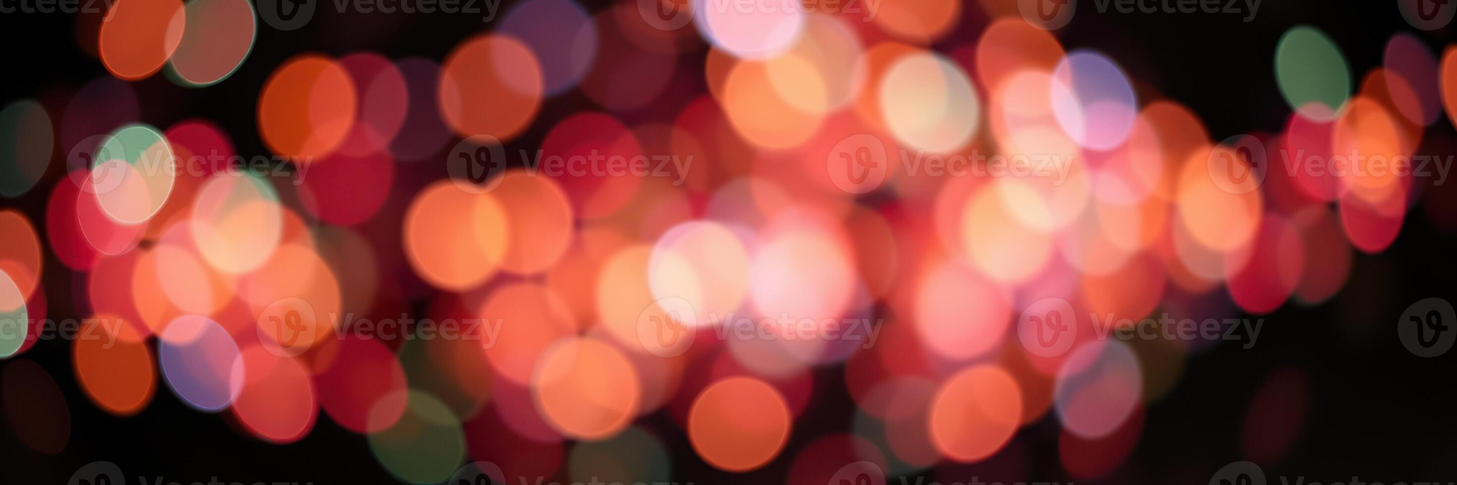 Colorful bokeh lights create a festive atmosphere during a nighttime celebration in an urban setting photo