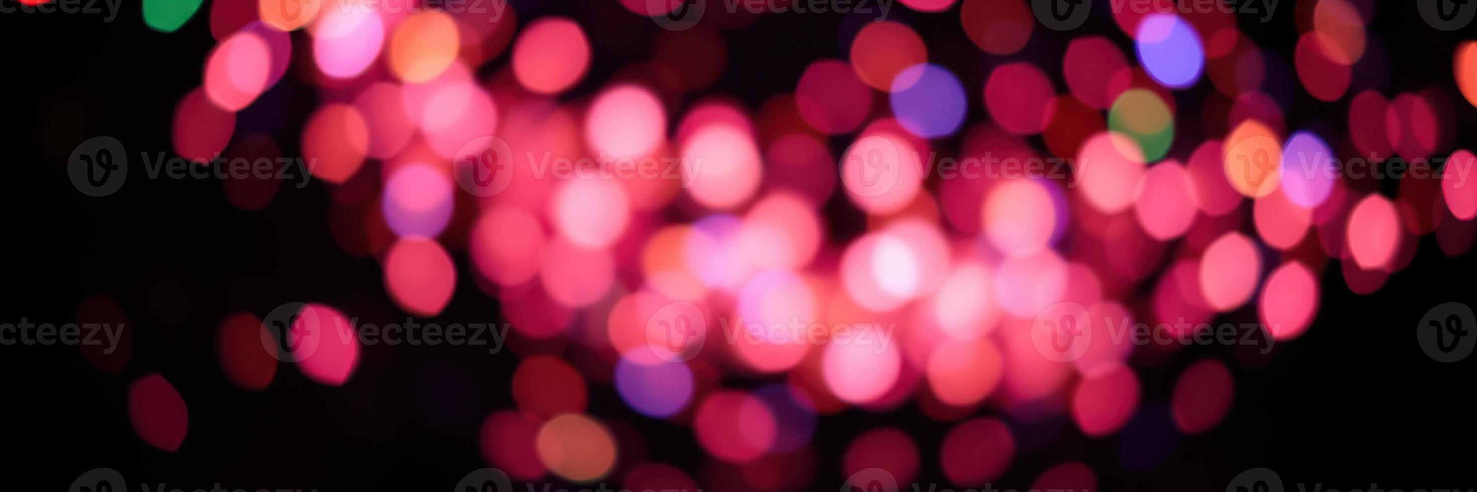 Colorful bokeh lights create a festive atmosphere during a vibrant celebration at night photo