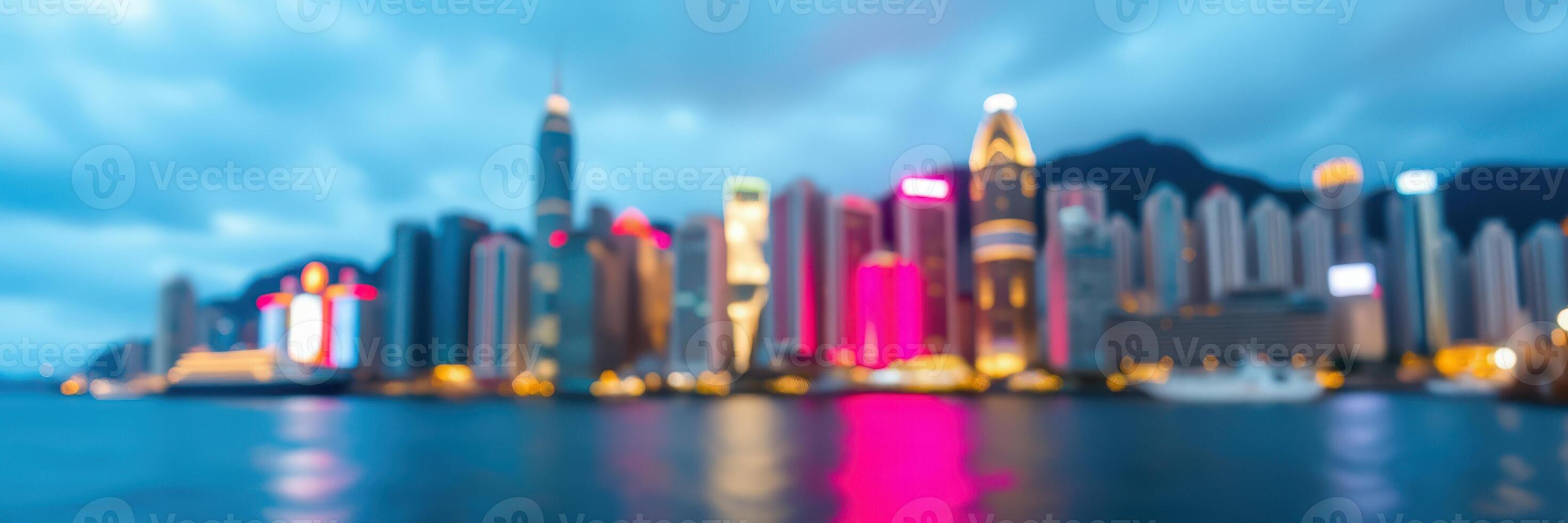 Vibrant cityscape of Hong Kong at night with colorful lights reflecting on the water photo
