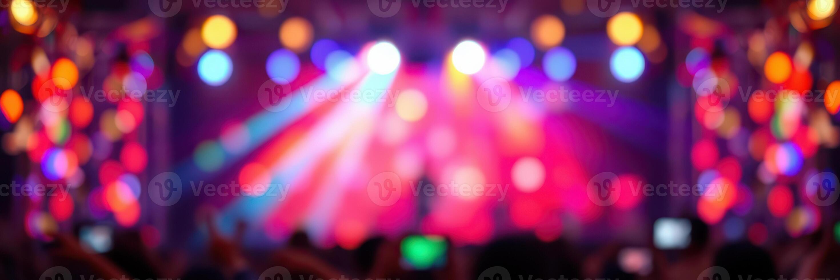 Colorful light display at a vibrant concert featuring energetic performances and lively audience reactions photo