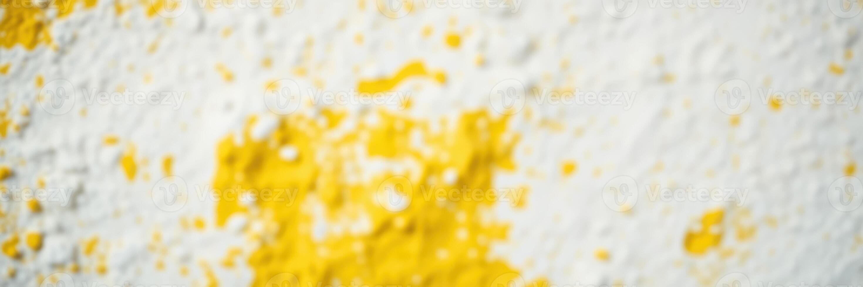 Bright yellow powder sprinkled on a white surface creating an artistic and textured visual element in a creative workspace photo