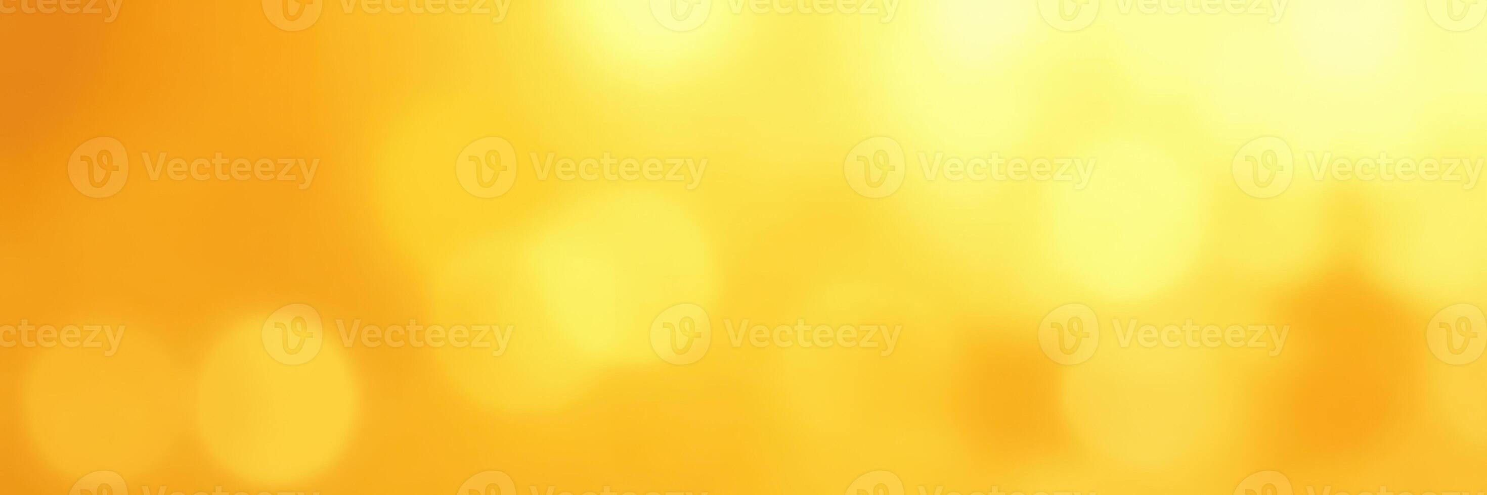 Vibrant golden background shining with warm light and soft bokeh effects during a summer evening photo