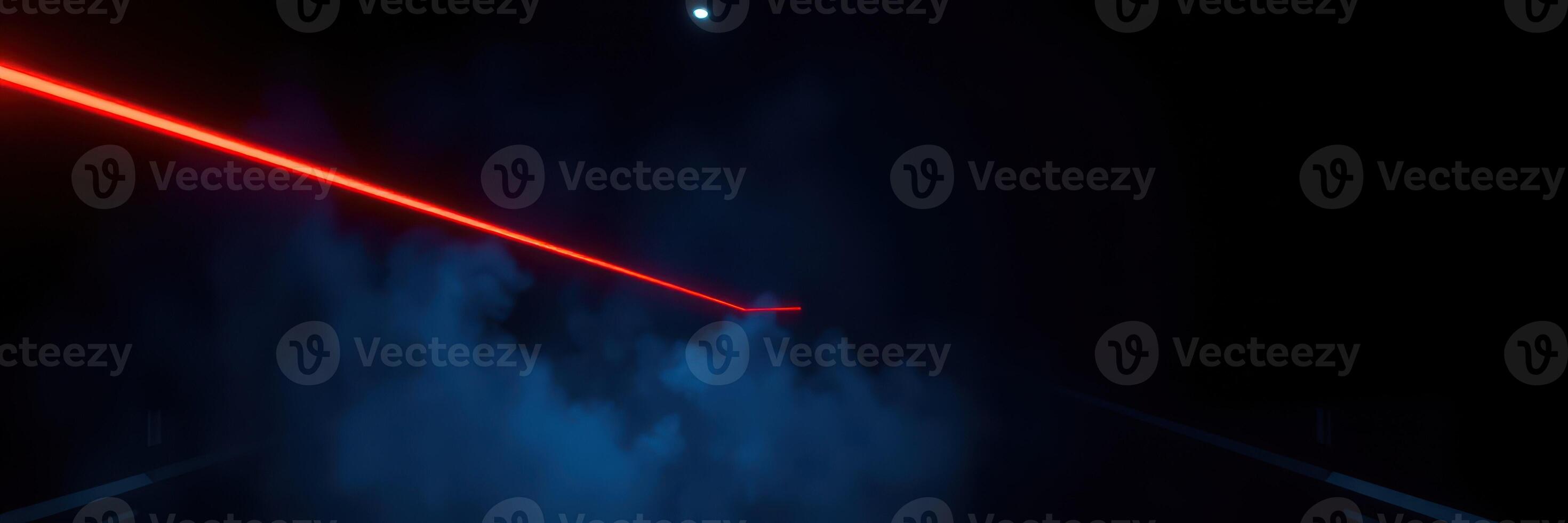 Vibrant laser cutting through dark fog in an atmospheric setting during a nighttime event photo