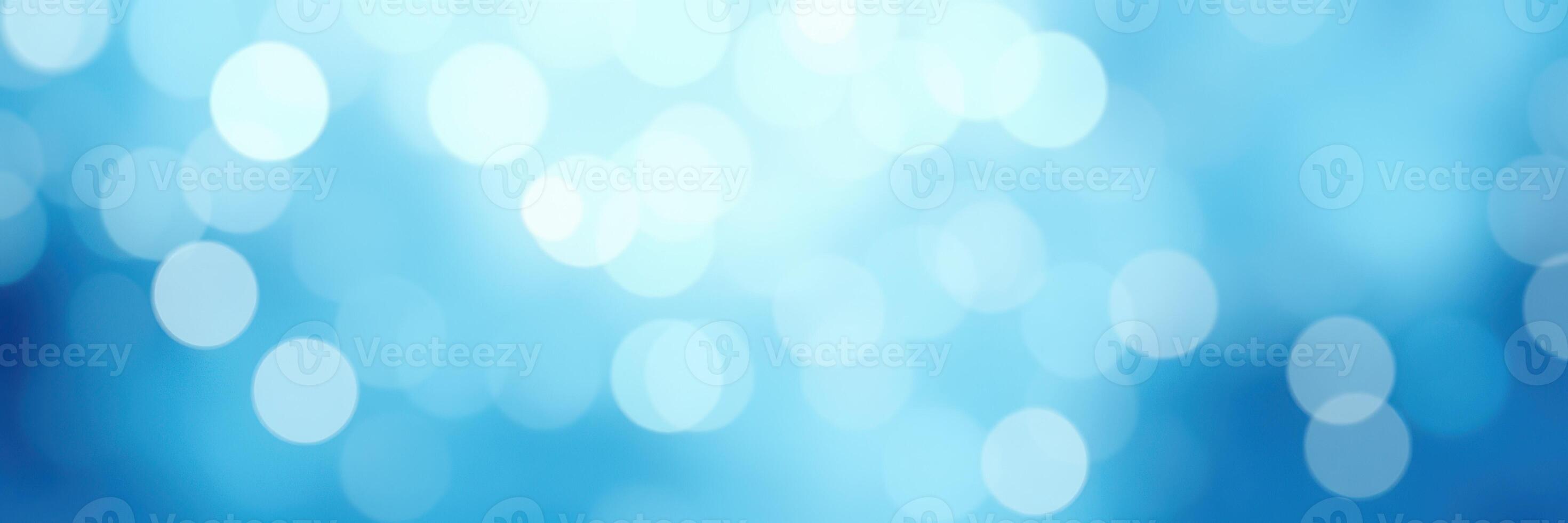 Soft blue glimmers of light create a serene atmosphere in this abstract background image ideal for calming designs photo
