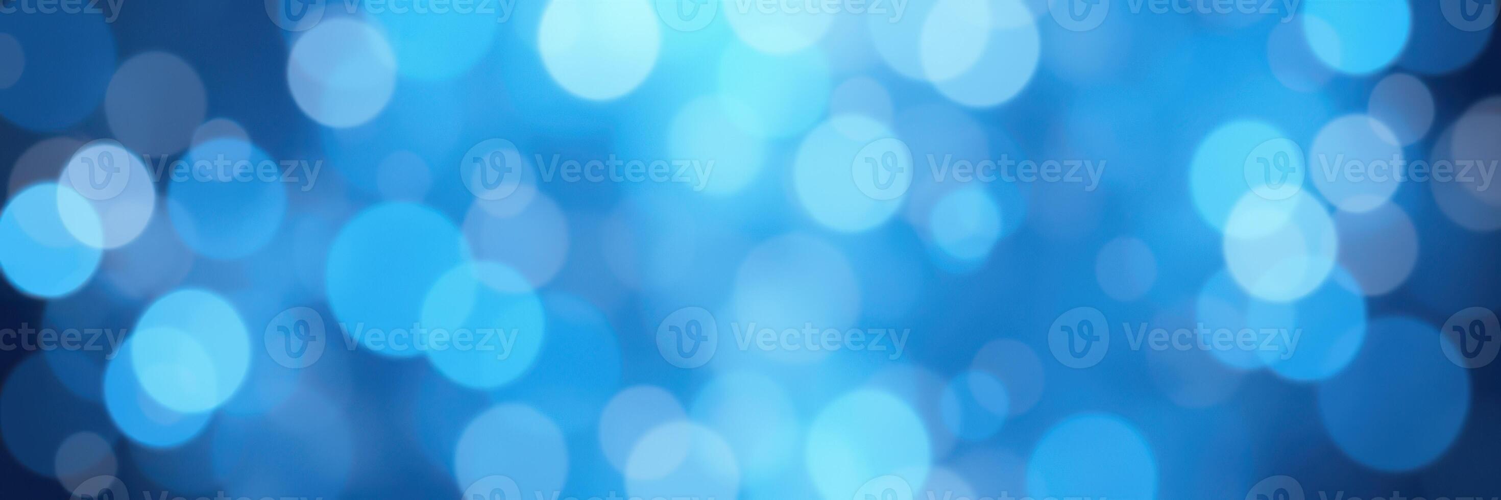 Beautiful blue bokeh background with soft, blurred circles creating a calming atmosphere for design projects photo