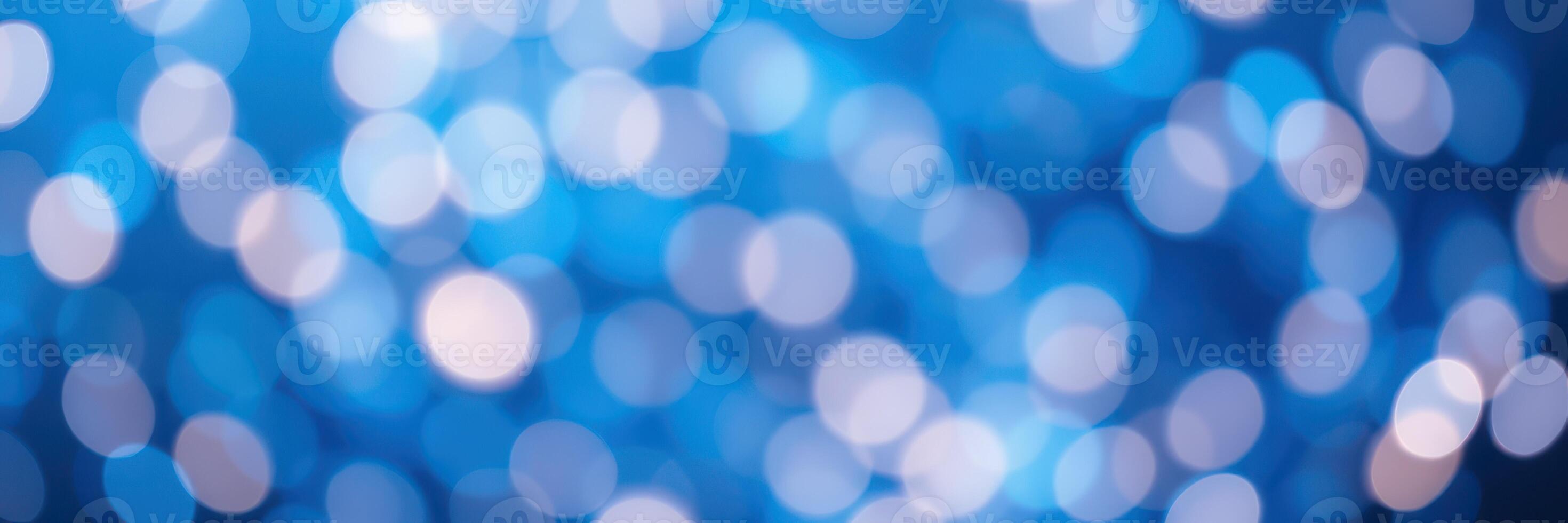Soft blue bokeh lights create a dreamy atmosphere during an evening celebration in a cozy indoor space photo