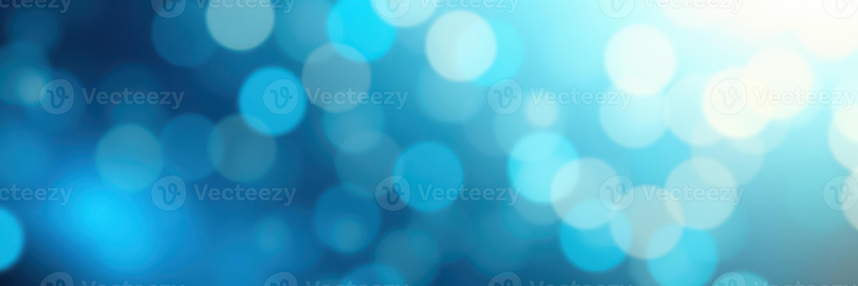 Soft blue bokeh lights create a dreamy atmosphere in a tranquil setting during the evening photo