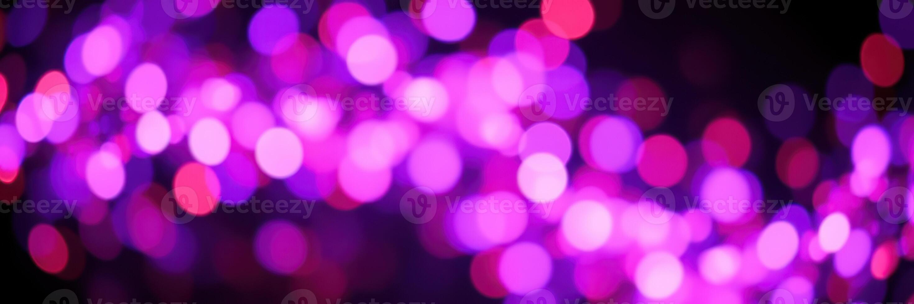 Colorful purple lights create a vibrant atmosphere in a festive setting during evening celebrations photo