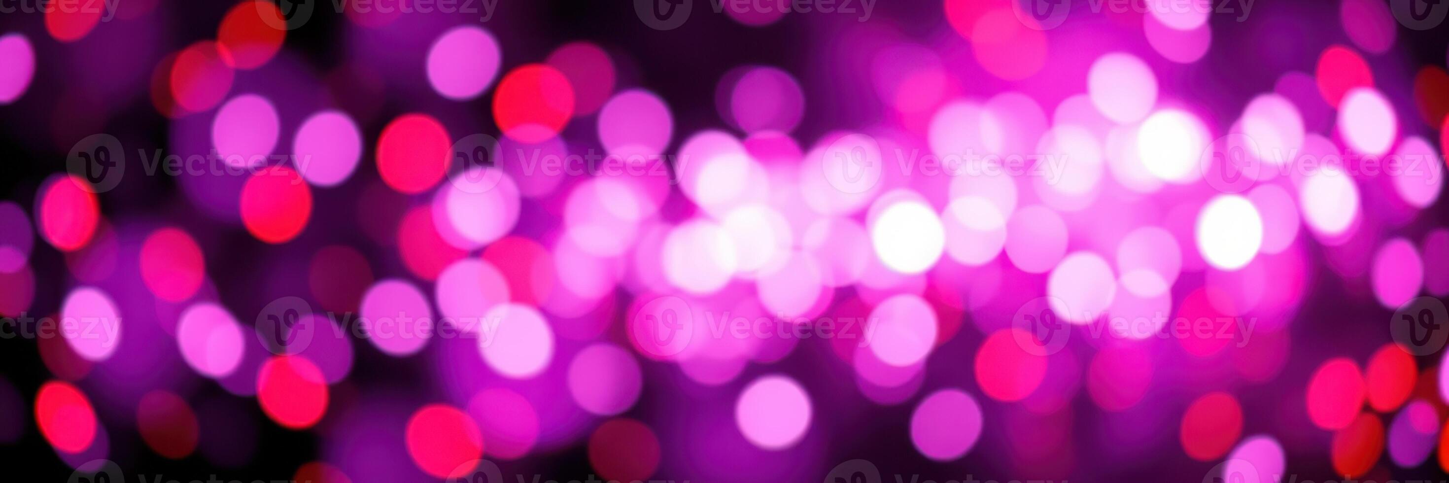 Colorful bokeh lights create a festive atmosphere during an evening celebration photo