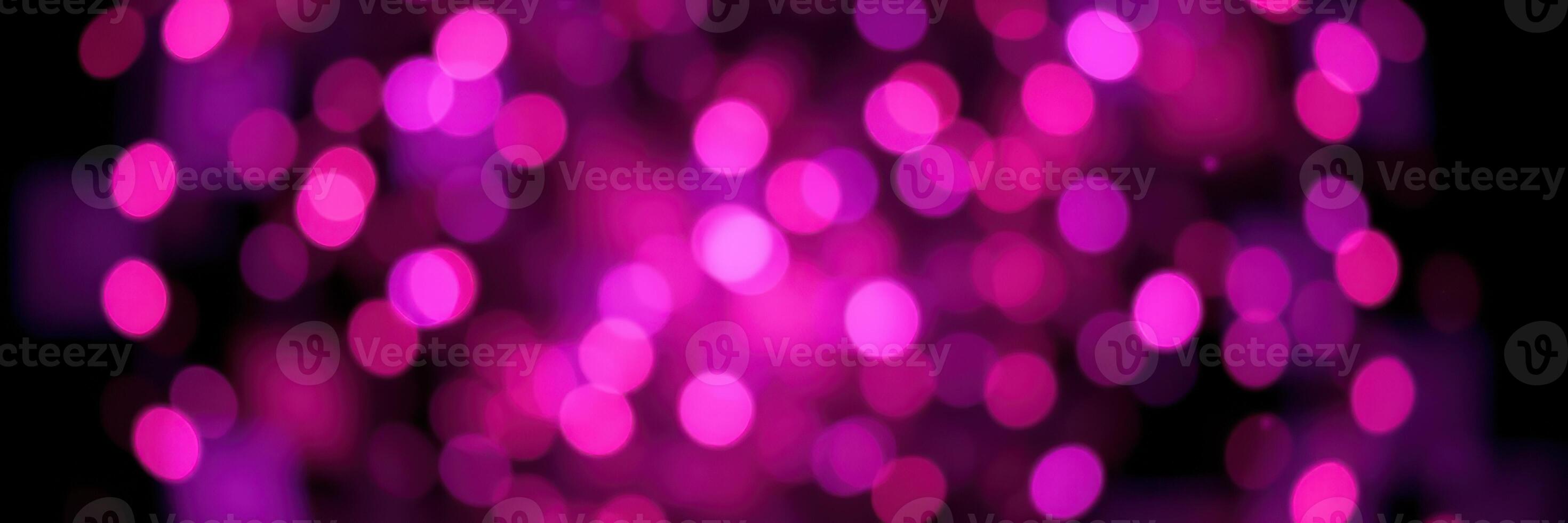 Colorful bokeh effect lighting in shades of pink creating a vibrant and festive atmosphere for celebrations photo