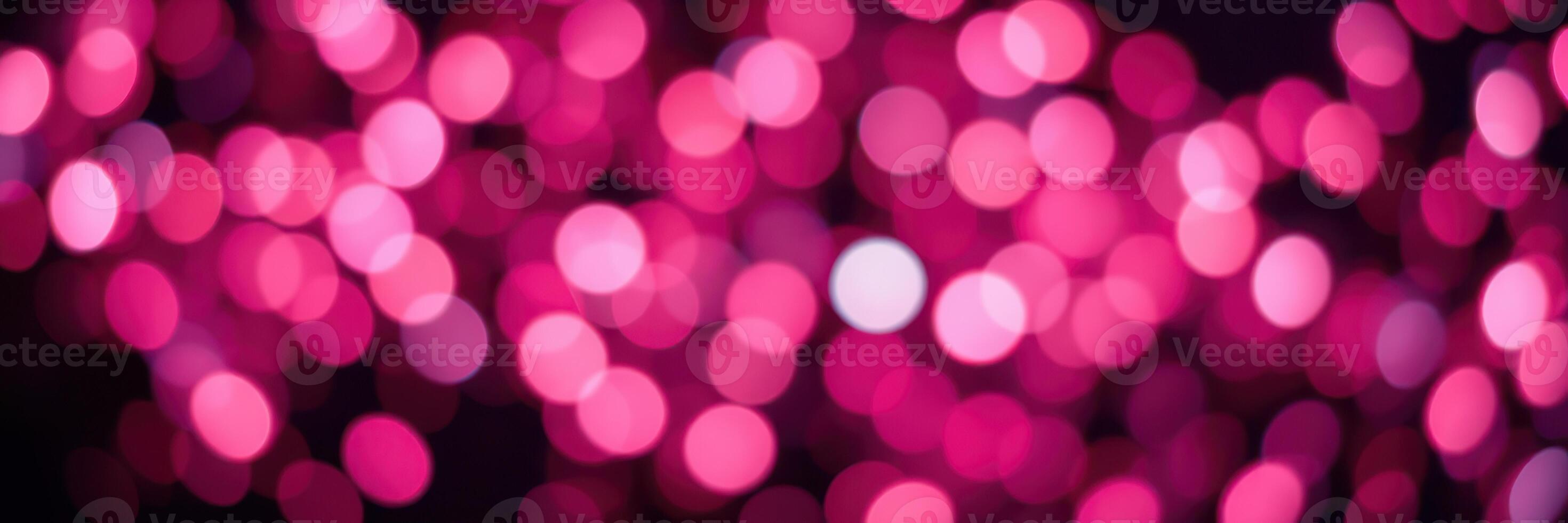 Vibrant pink lights create a festive atmosphere during a nighttime celebration at an outdoor event photo