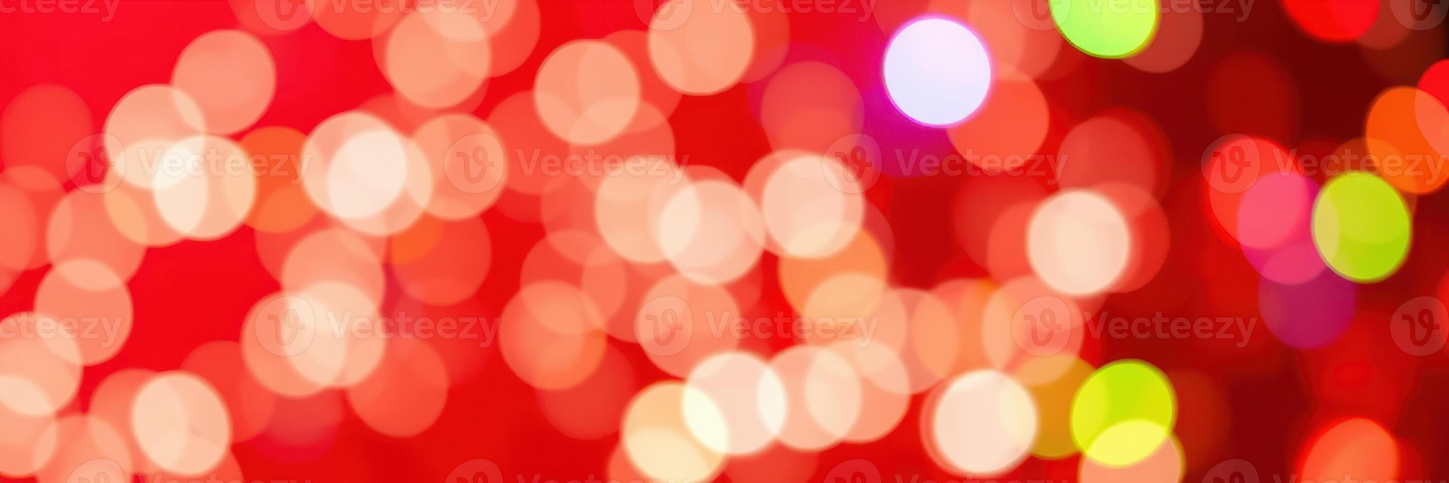 Colorful bokeh lights create a festive atmosphere during a winter celebration in an indoor setting at night photo