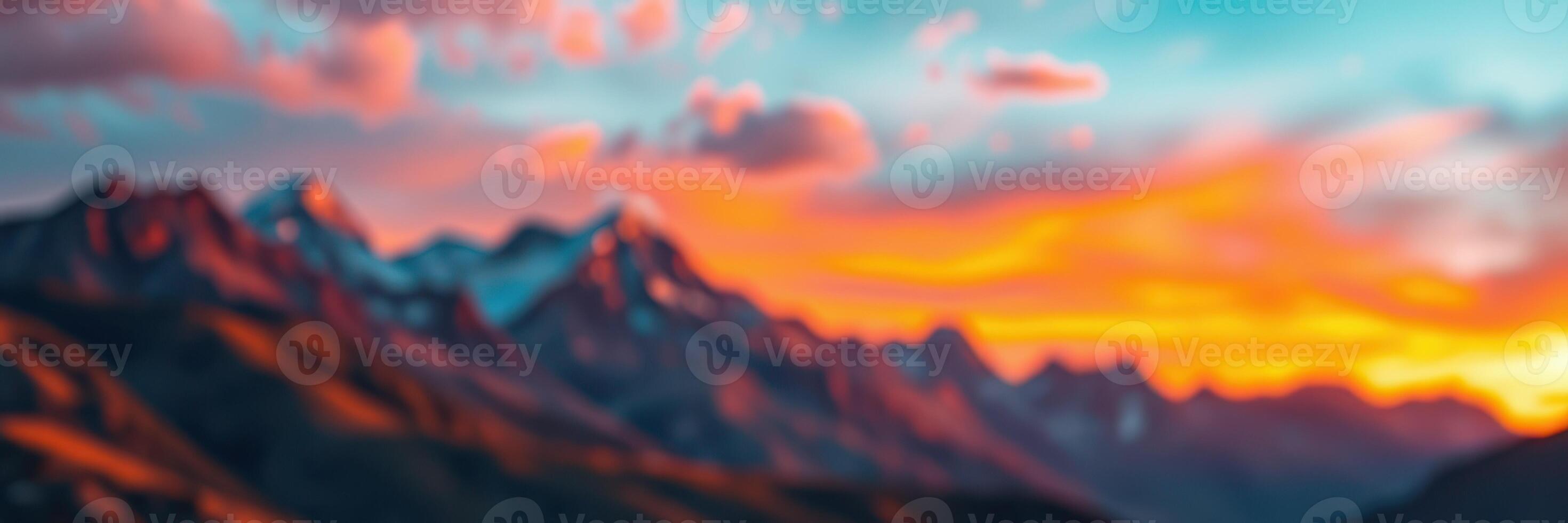 Beautiful sunset over mountain range with colorful clouds illuminating the sky photo
