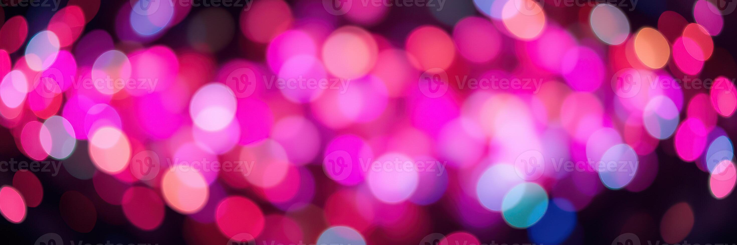 Colorful bokeh lights create a vibrant atmosphere during a nighttime event celebration photo