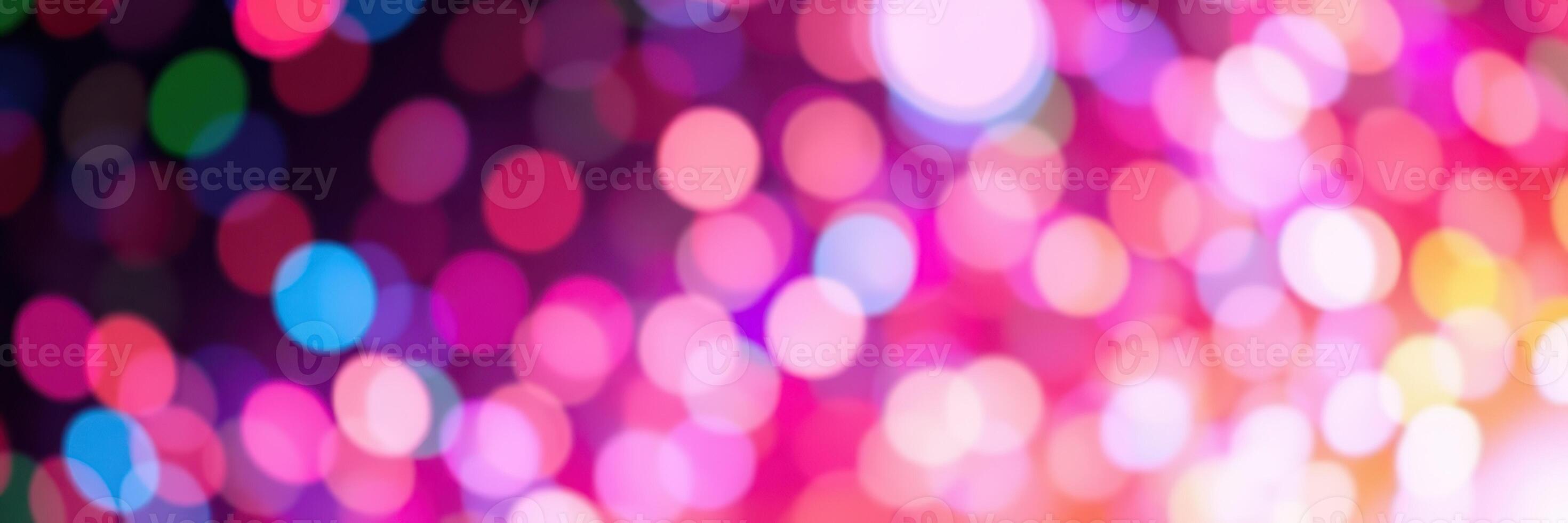 Colorful bokeh lights create a vibrant atmosphere during a nighttime celebration or event photo