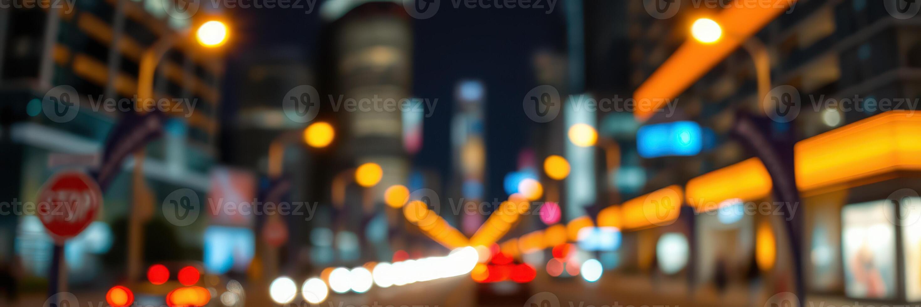 City lights illuminate a bustling urban street during the evening rush hour with blurred movement photo
