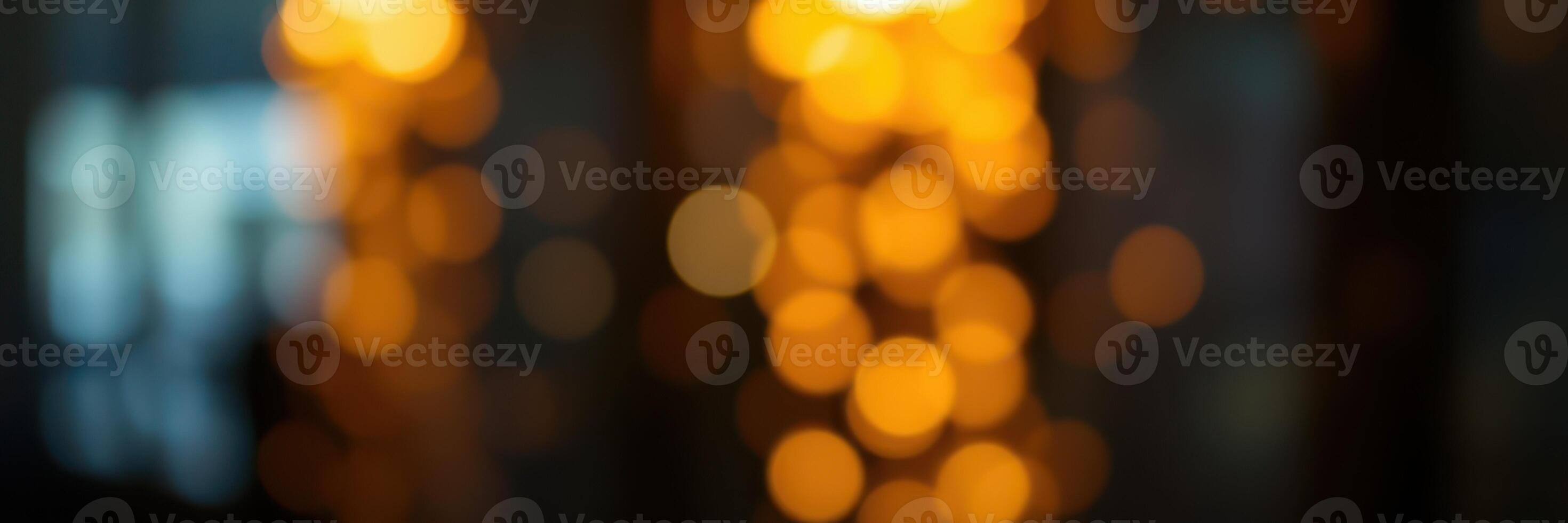 Background of blurred glowing lights creating a warm atmosphere in an indoor setting during evening hours photo