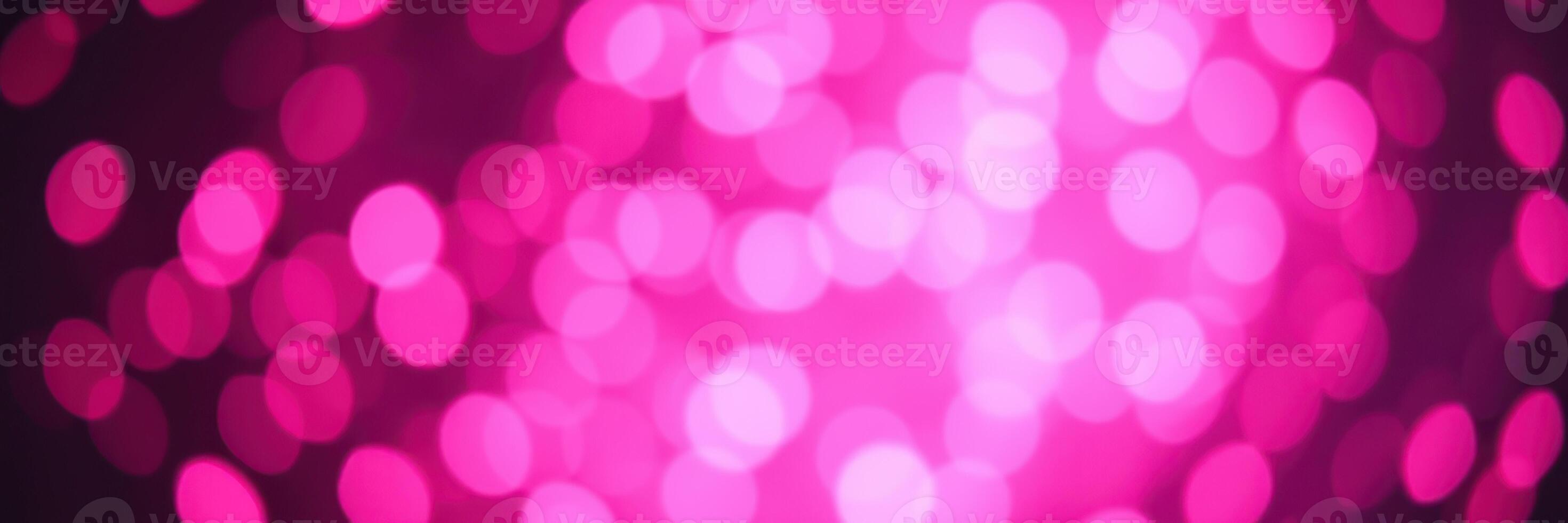 Vibrant pink bokeh lights create a festive atmosphere for celebrations and events during nighttime gatherings photo
