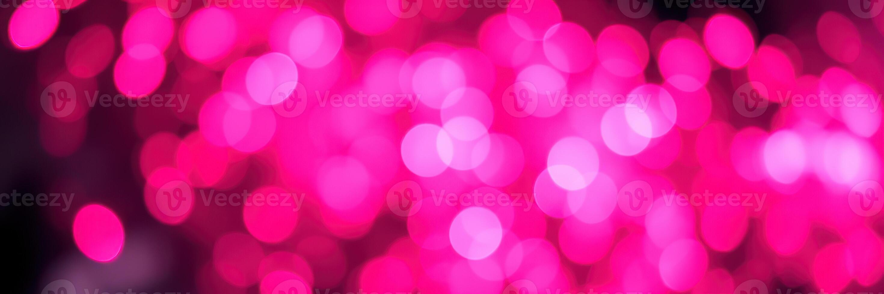Bright pink bokeh lights create a vibrant atmosphere for celebrations and events photo