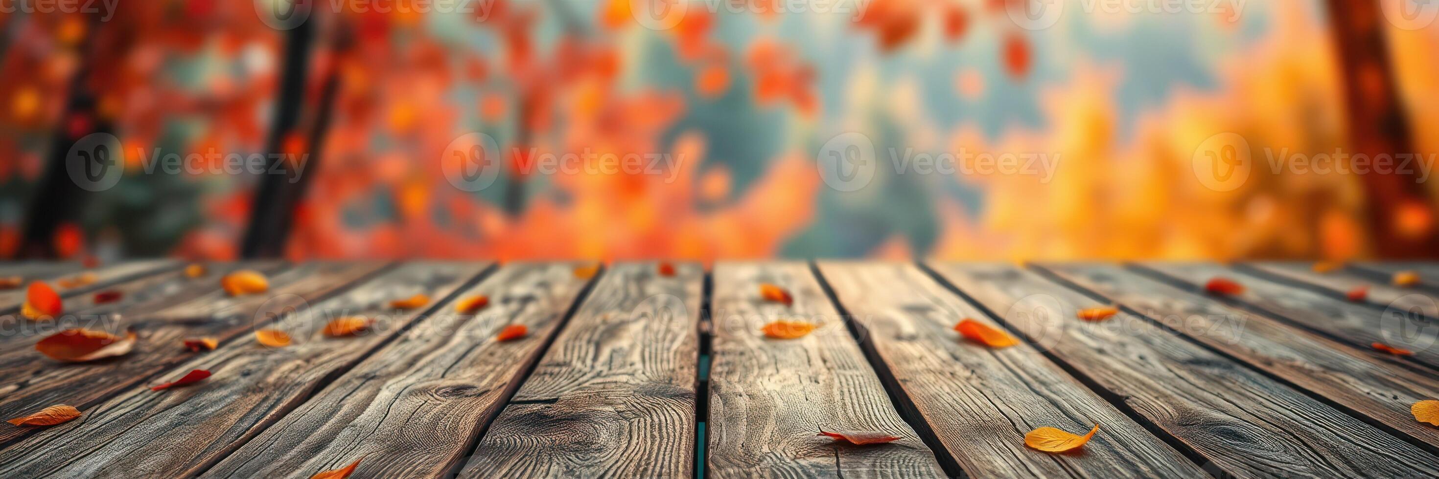 Colorful autumn leaves scattered on a rustic wooden surface in a serene outdoor setting during the fall season photo