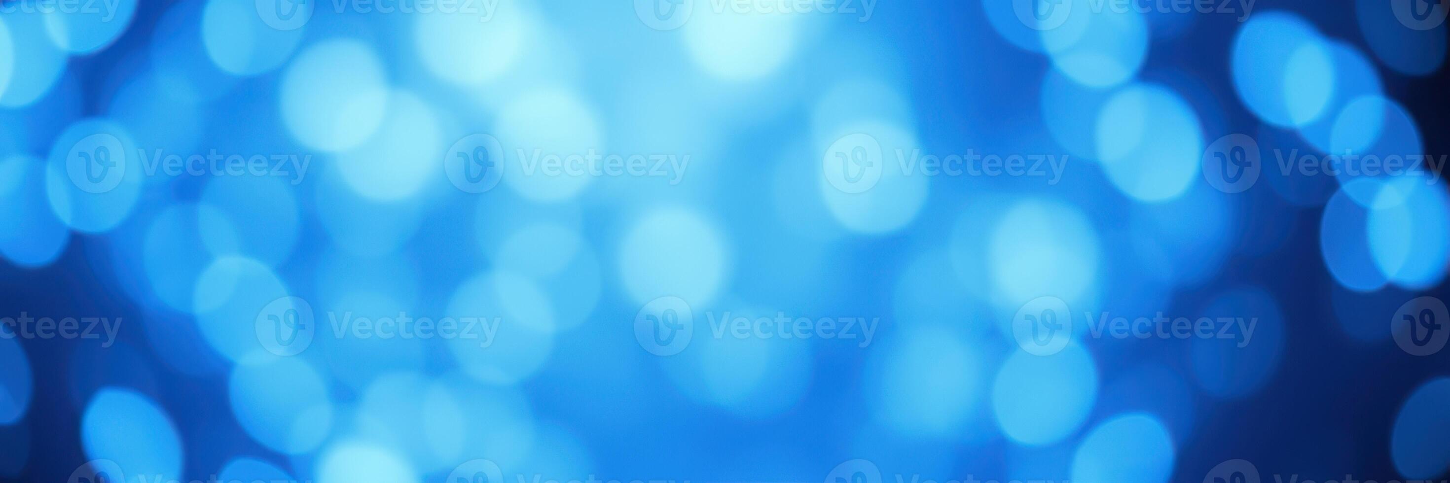 Vibrant blue bokeh lights create a dreamy atmosphere in an abstract setting photo