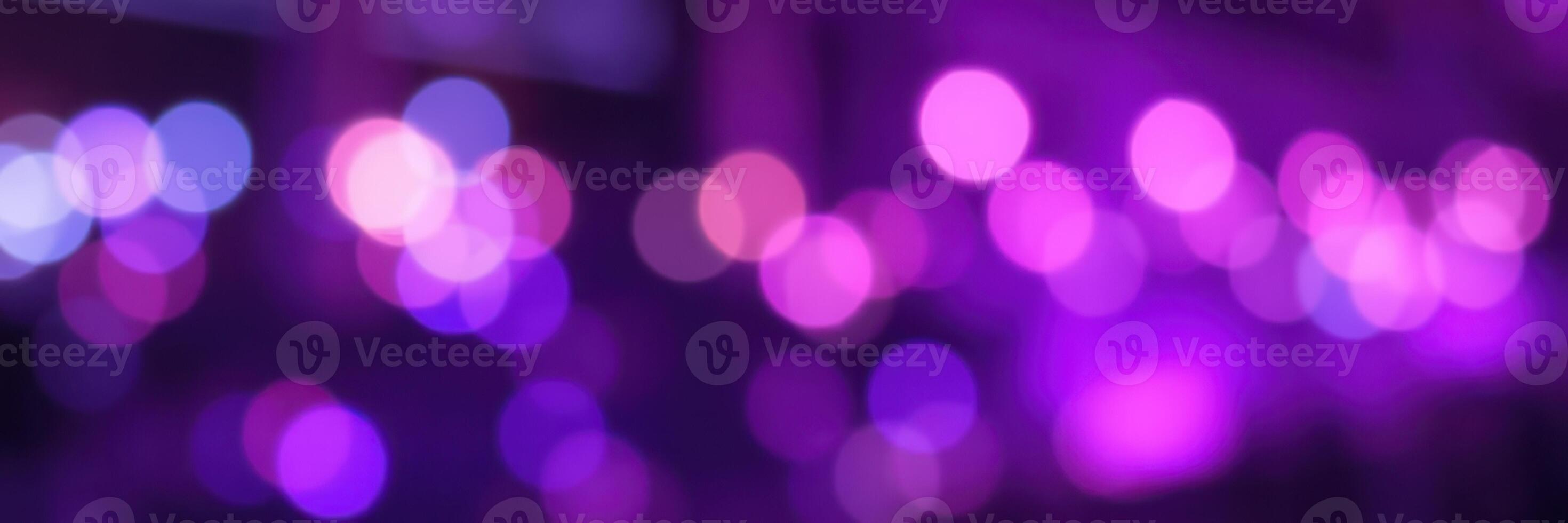Colorful bokeh lights create a vibrant atmosphere at evening celebration event in urban setting photo