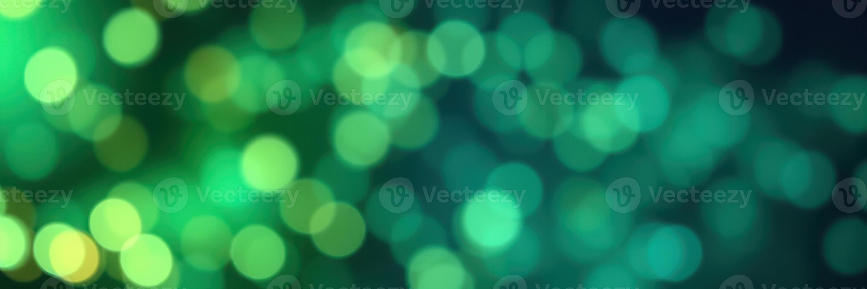 Colorful bokeh lights create a vibrant atmosphere during an evening celebration in a city park photo