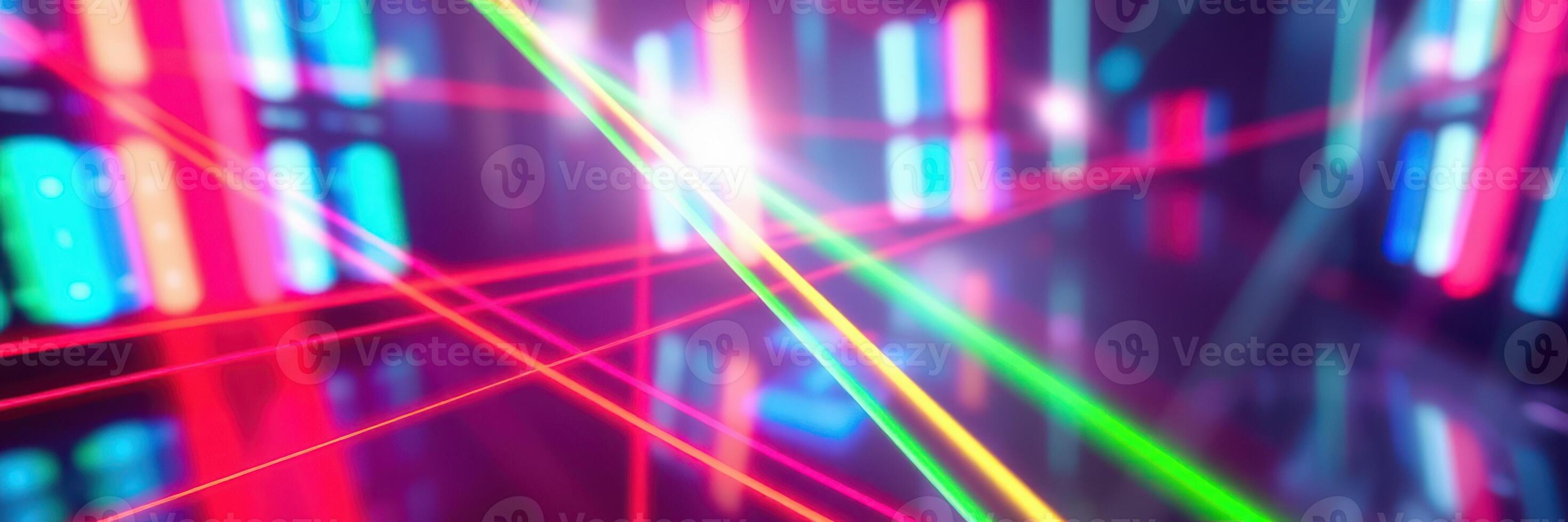 Colorful laser lights create vibrant patterns in a dark nightclub during a lively dance event photo