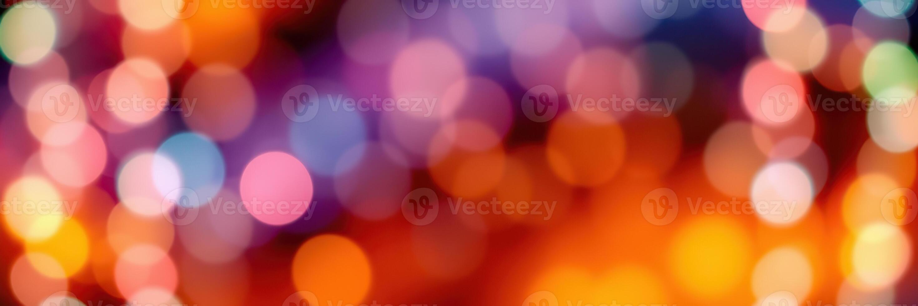 Colorful bokeh lights create a vibrant atmosphere during a festive evening celebration in the city photo