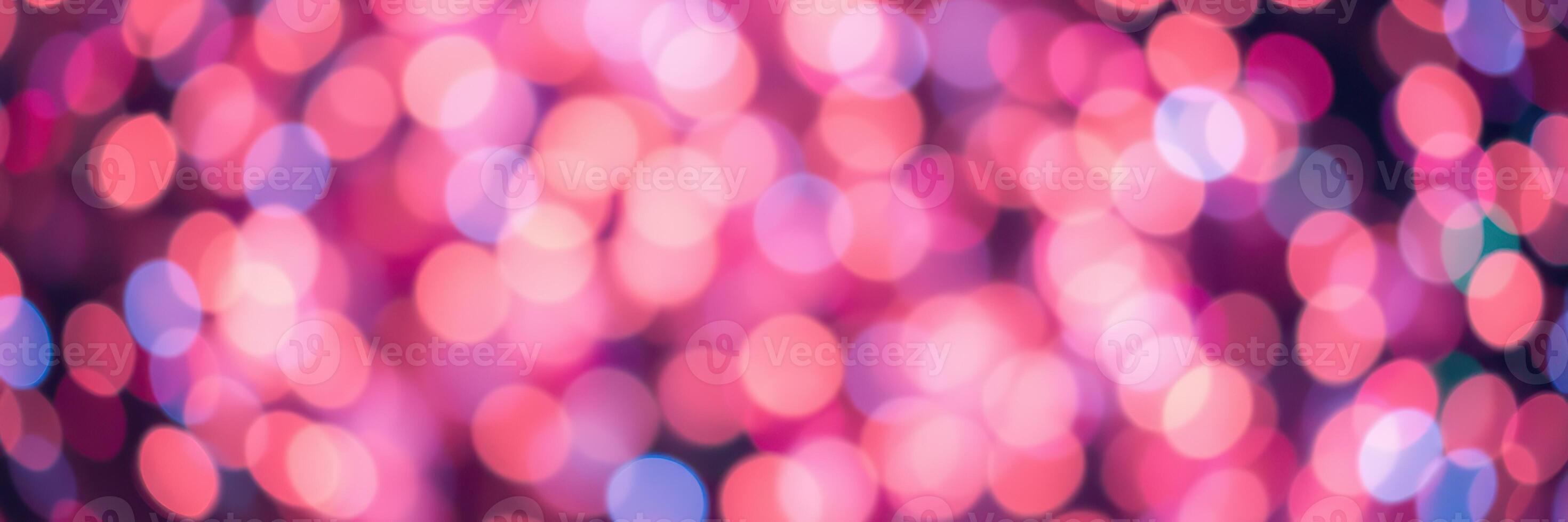 Colorful bokeh lights create a festive atmosphere during a celebration at night in an urban setting photo