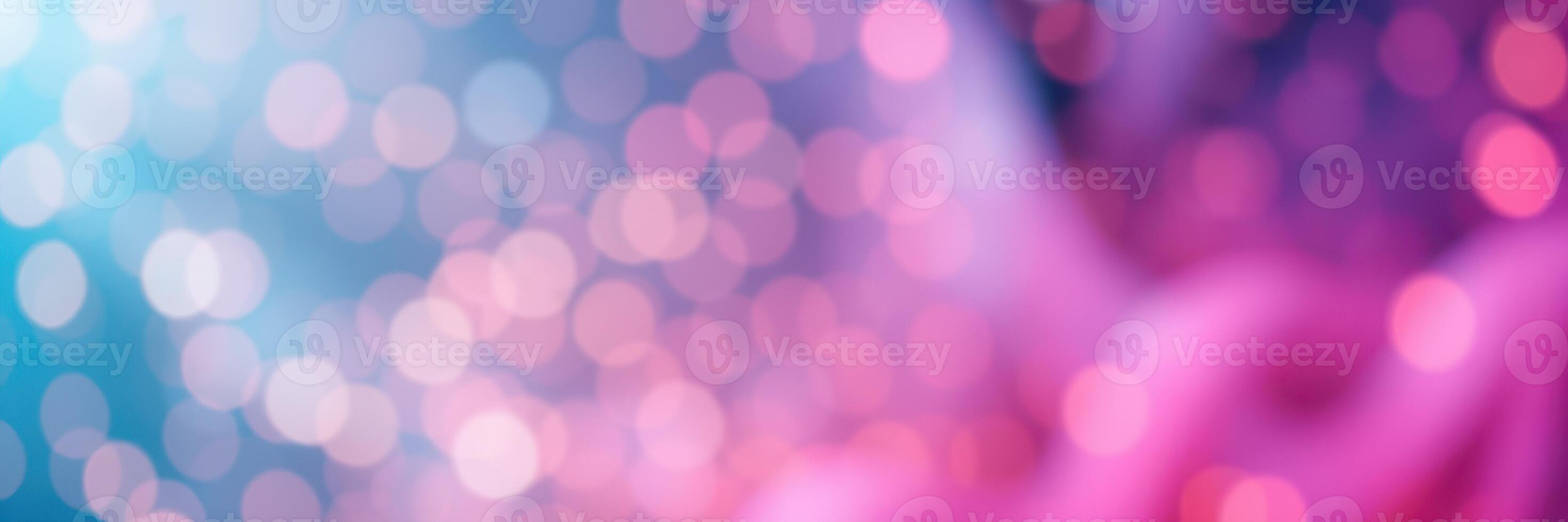 Colorful bokeh background with vibrant pink and blue hues creating a dreamy atmosphere in a soft focus setting photo